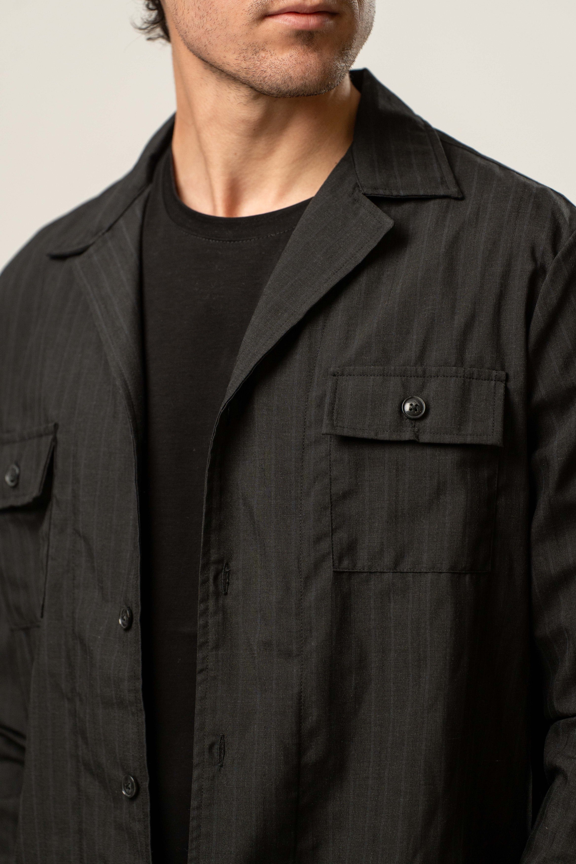 Giacca uomo in tessuto gessato nero modello casual