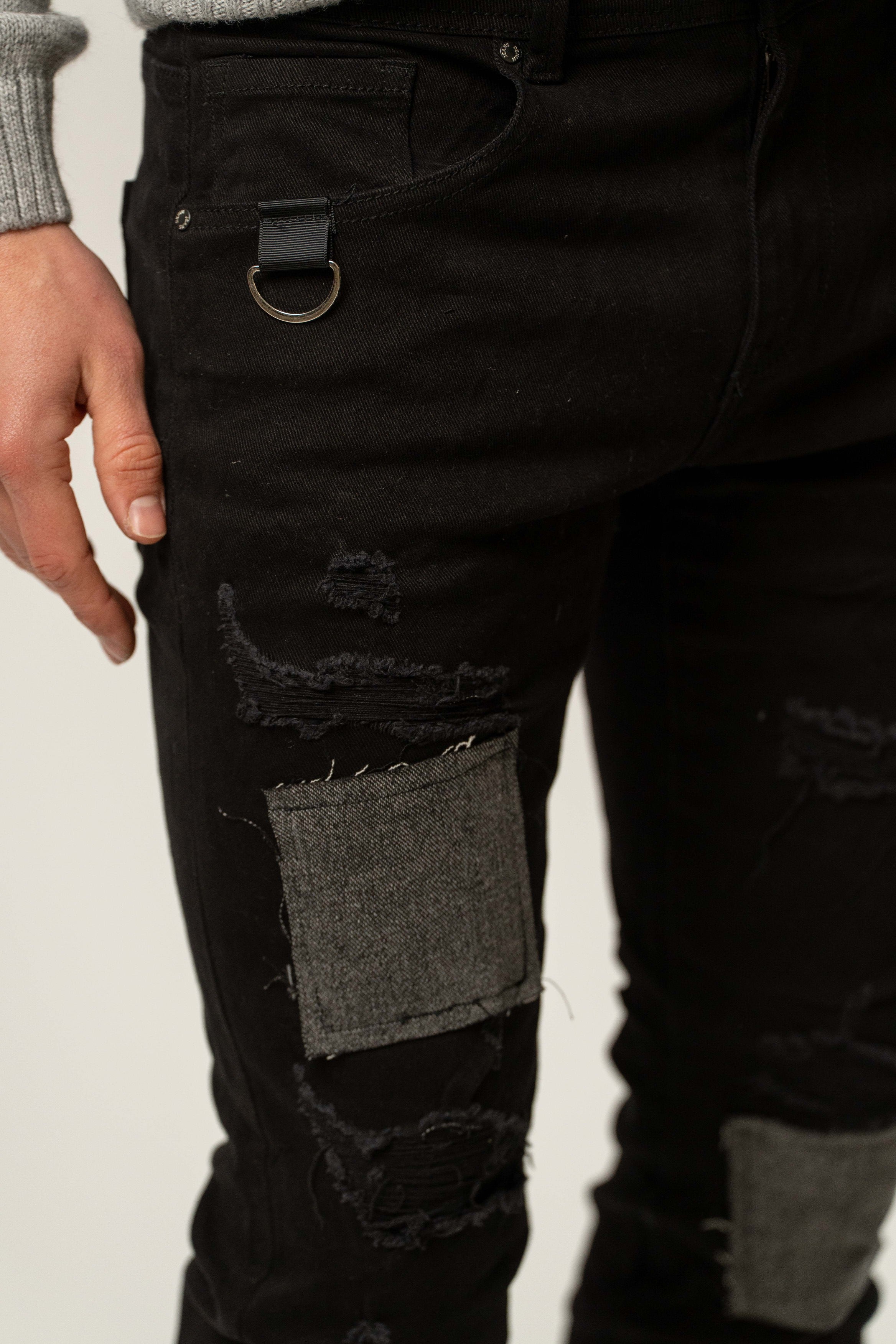 Jeans uomo slim fit neri con patch